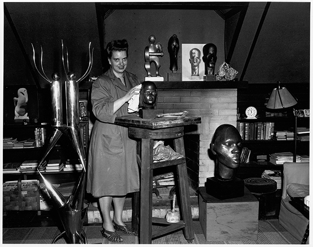 Evelyn Raymond with her works, ca. 1940